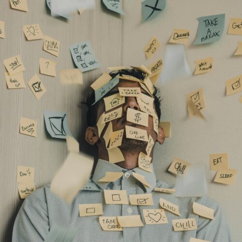 Post-its with tasks and tips. Stress Management. Photo by Luis Villasmil on Unsplash.